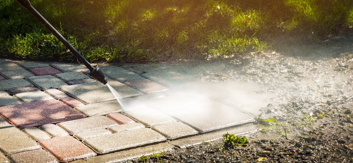 Dirty block paving before JTR Services pressure washing