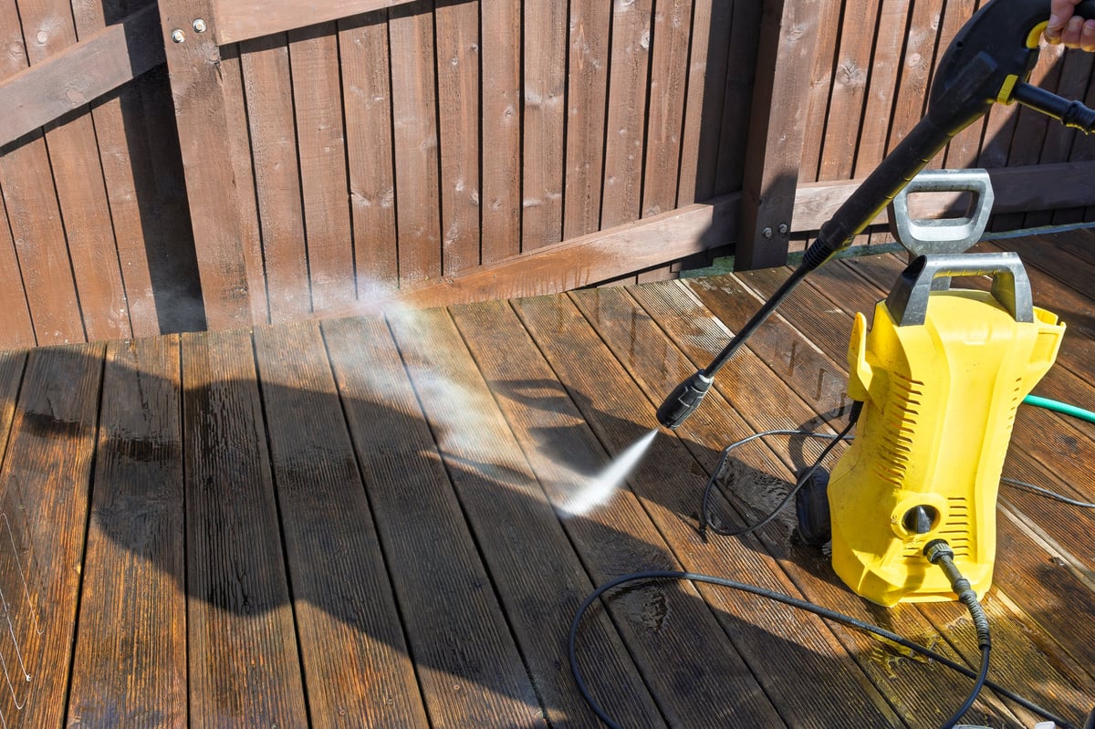 Wooden garden decking cleaned to a bright finish with a water jet