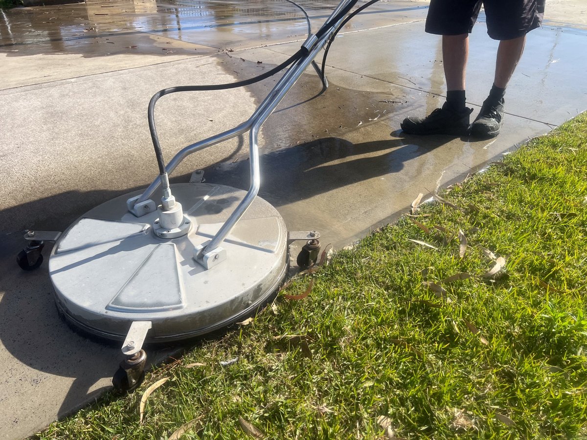 Outdoor surface covered in grime, mould and loose debris before cleaning
